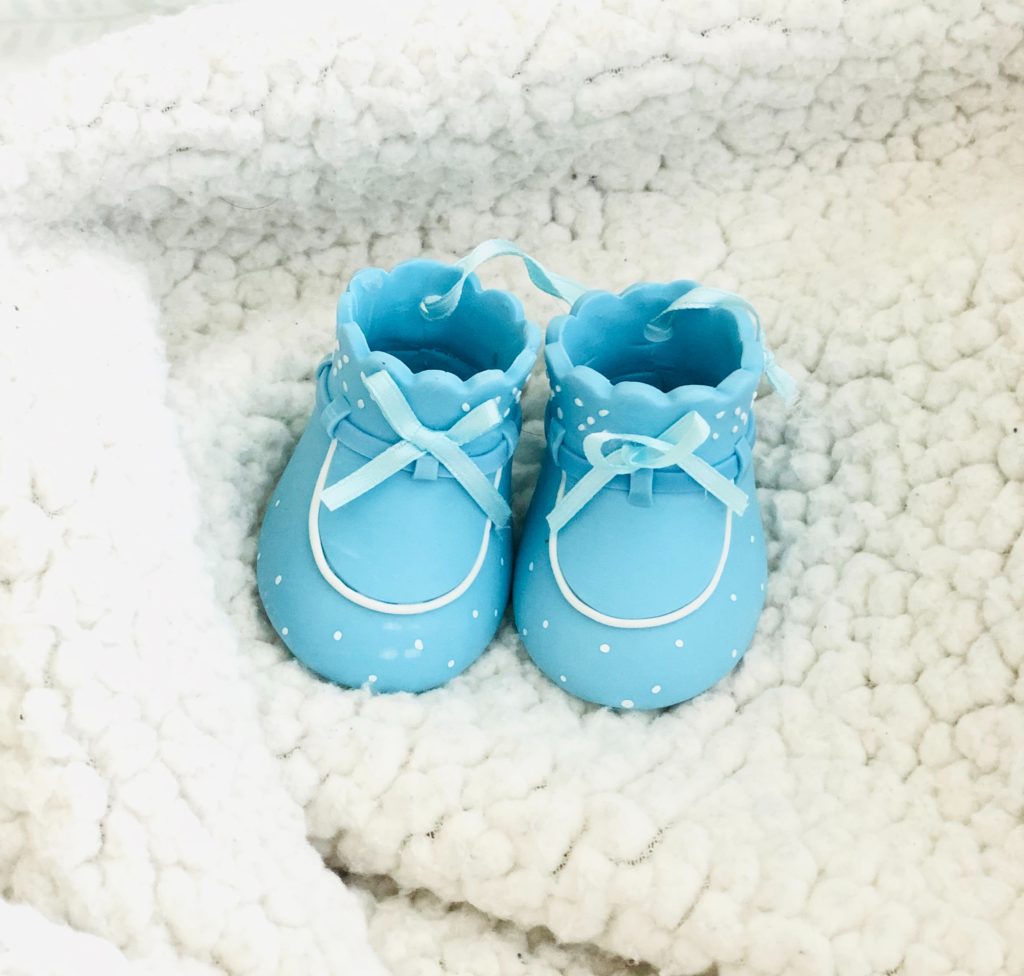 best app for new mom 3 - baby shoes as gift on a blanket